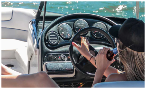 Woman steering boat